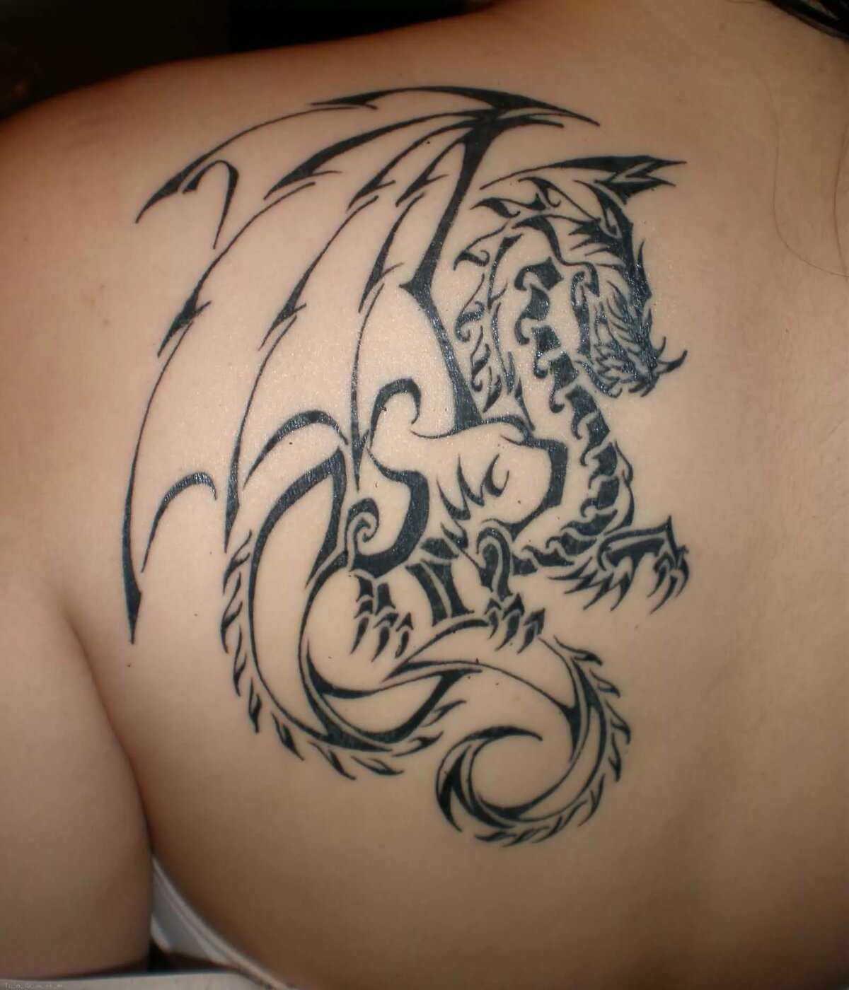 Значение тату дракона у девушки в разных культурах